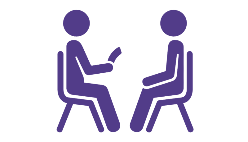 Logo of two people looking at each other sitting down on chairs.
